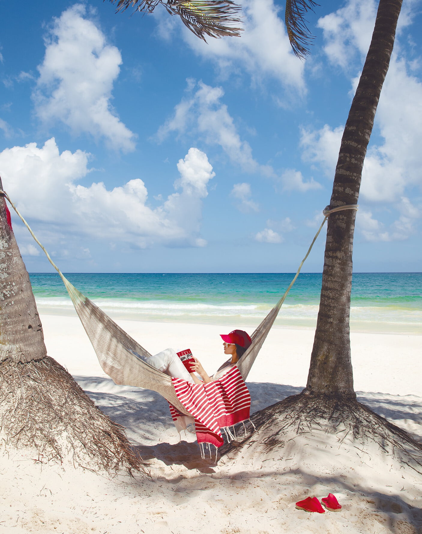 Reading in a hammock on the beach at Faena Tulum